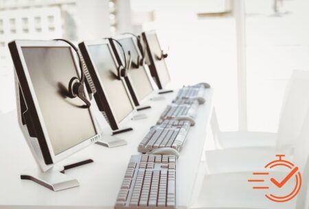 A lineup of computers donning headsets, prepared to manage service requests and provide support.