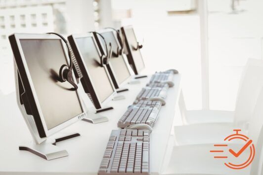 A lineup of computers donning headsets, prepared to manage service requests and provide support.