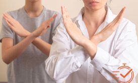 Two individuals use hand gestures to convey a message, reflecting the nuances of unconscious bias training in their interaction