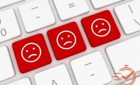 A keyboard with three red smiley faces, symbolizing the challenge of dealing with a difficult customer types