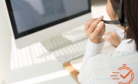 A woman in a headset, engaged in a phone call, focused on providing first contact resolution training for customer support.