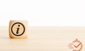 a wooden block on a desk representing a guide on keep your customers informed of your products and services