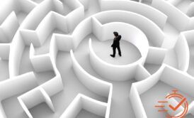 A man confidently stands in a maze, symbolizing successful problem solving course