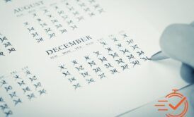 A visual guide showing a calendar filled with markings for a small business year-end checklist.