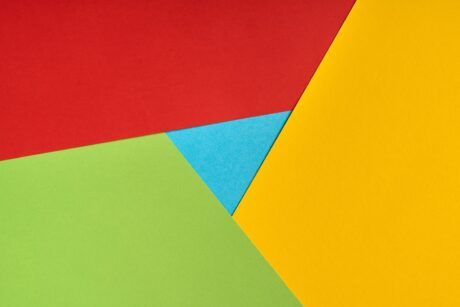 a vibrant piece of paper showcasing a triangle shape in the middle illustrating how to create google chrome extension